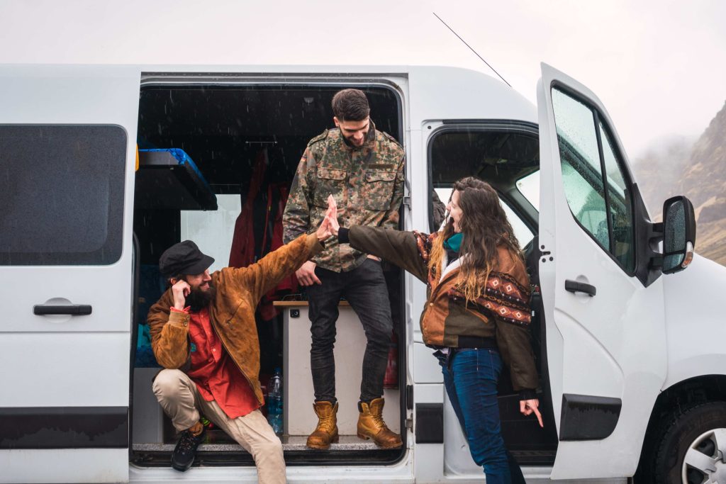 group of people outside sprinter van