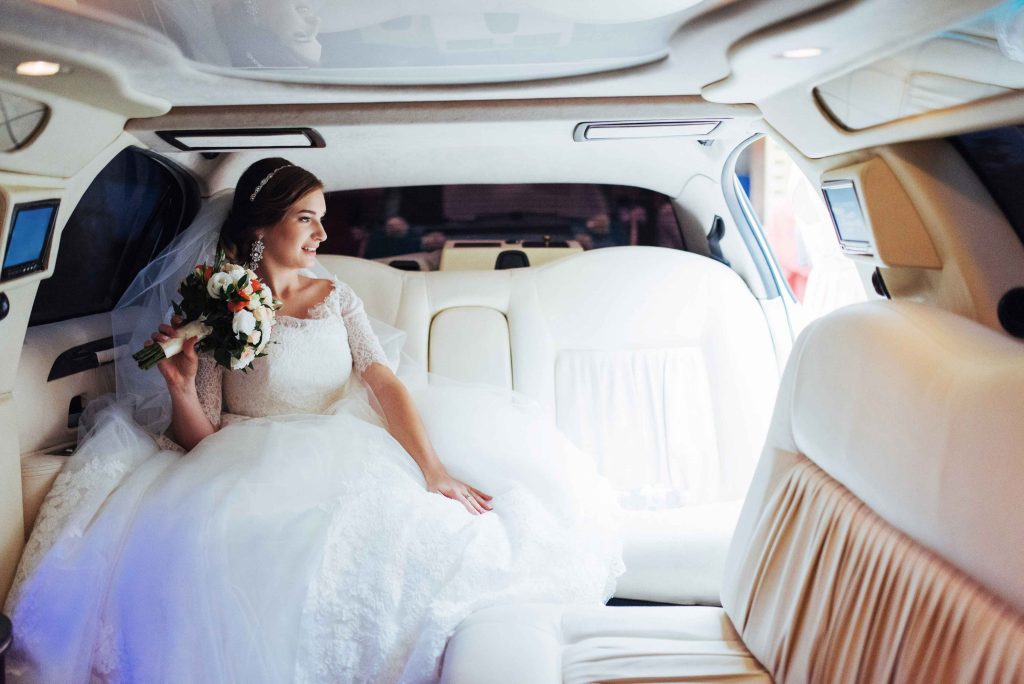 Austin Wedding Transportation bride sitting in limo